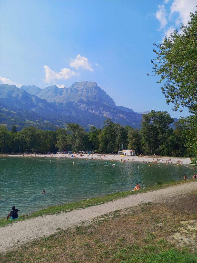 Alpine lake with swimming beach in the Arve Valley near Mont Blanc in the French Alps