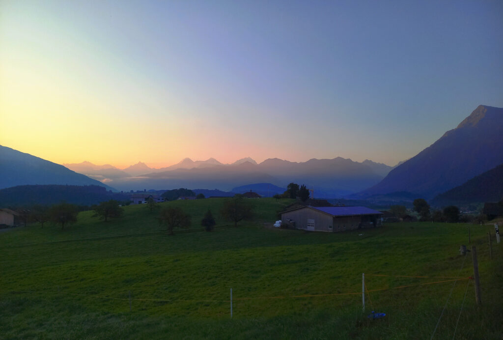 sunrise over Bernese Alps landscape near Thun Switzerland