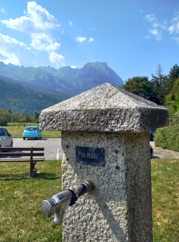 Public drinkig water fountain in the French Alps on the way toward Mont Blanc