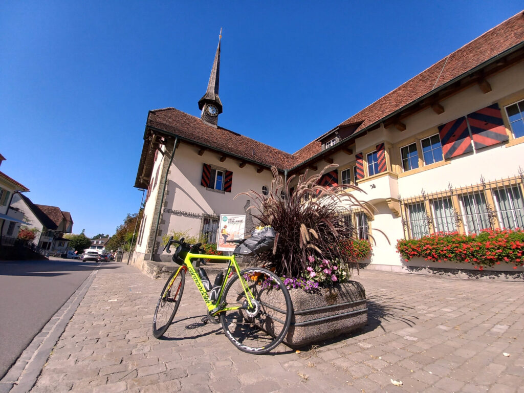 Road bike parked in front of the historic Gemeindehaus in Ins, Switzerland