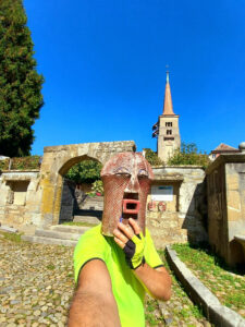 cycling selfie with a mysterious wooden mask near Lake Neuchâtel, Switzerland