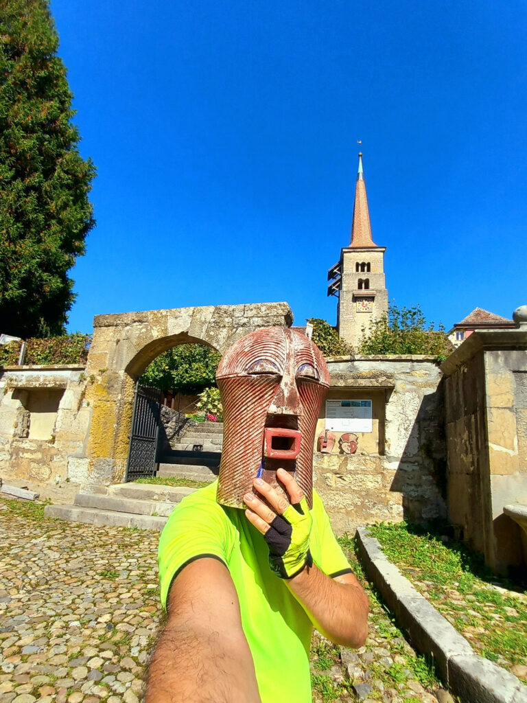 cycling selfie with a mysterious wooden mask near Lake Neuchâtel, Switzerland