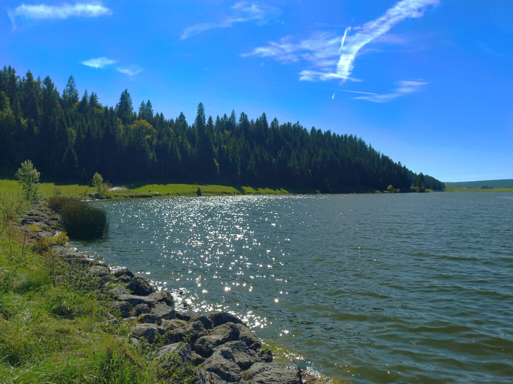 Sunlight reflecting on Lac des Taillères in Switzerland