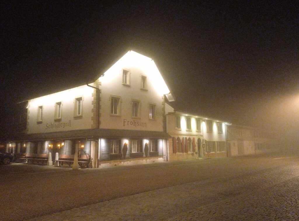 Foggy winter night in the Swiss village of Holderbank during a long cycling ride home
