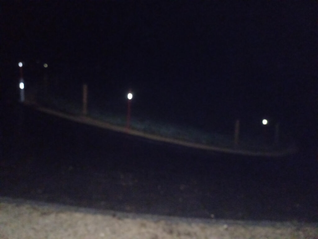 Dangerously icy climb during a cold winter night ride in the Swiss Jura mountains near Belchenflue