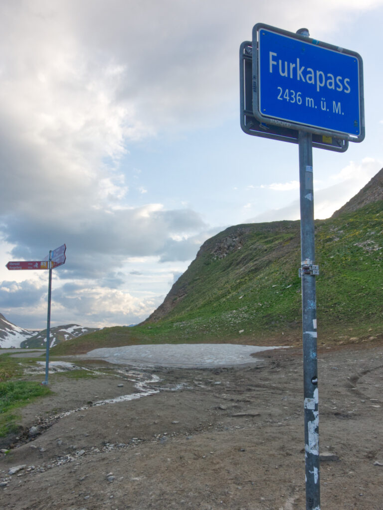 Furka Pass summit sign at 2,436 metres.