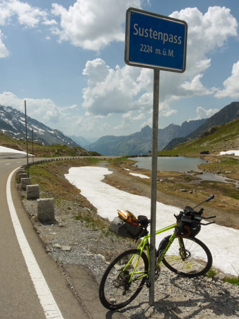 Road bike beside the Susten Pass sign at 2,224metres.