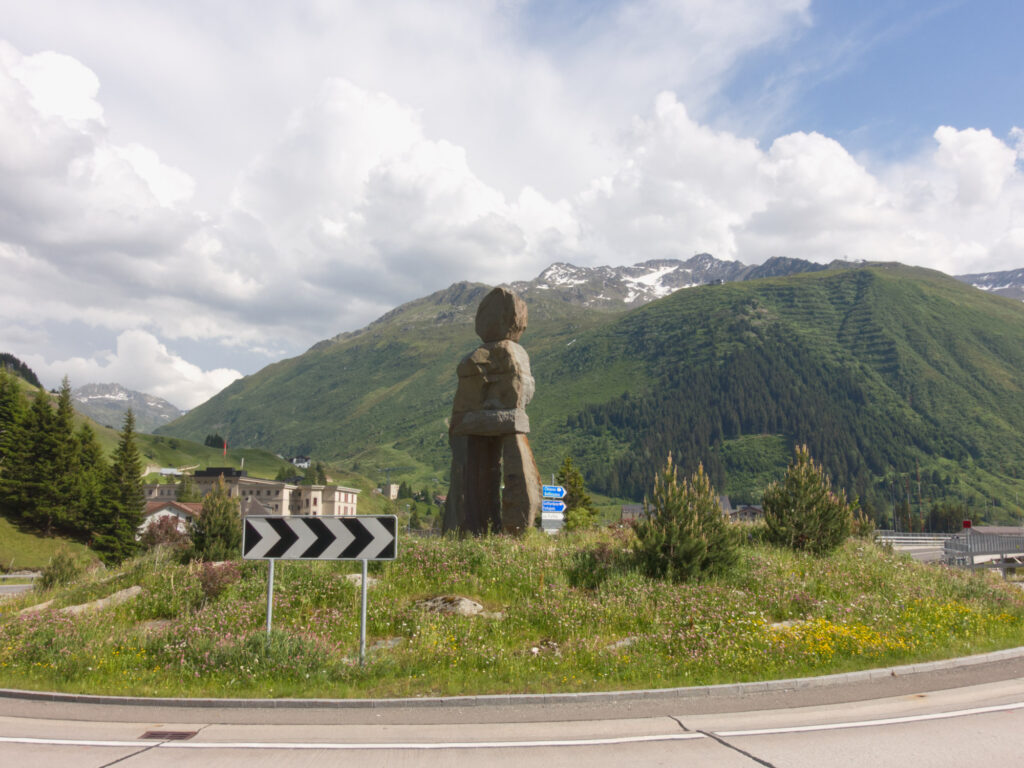 Steinmandli Human Nature stone sculpture at the entrance to Andermatt.
