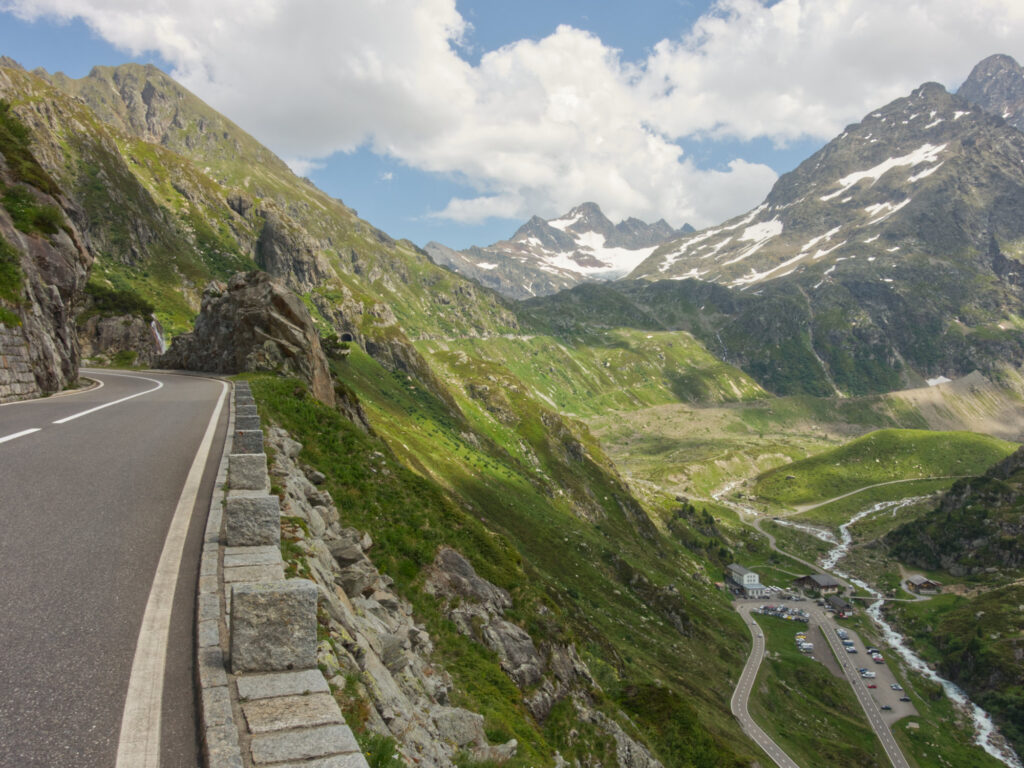 High alpine road below snowy peaks on Susten Pass.